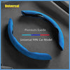 A blue premium suede universal car model steering wheel cover shown on a dark surface.
