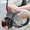 Hands holding a black U-shape car door edge protector trim for automotive use.