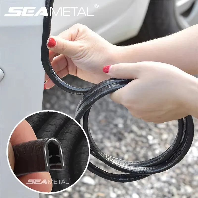 Hands holding a black U-shape car door edge protector trim for automotive use.