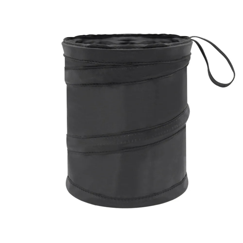 A black waterproof collapsible car trash can bag with a drawstring closure.