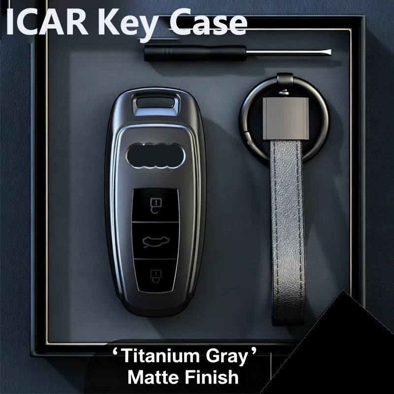 Titanium Gray matte finish ICAR key case with a key and lanyard displayed in a dark box.