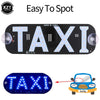 A black LED light panel with the word TAXI illuminated in white lights, used as a car taxi indicator.