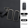 A set of four black zinc alloy car key cases with leather straps and a silver key shown against a dark background.