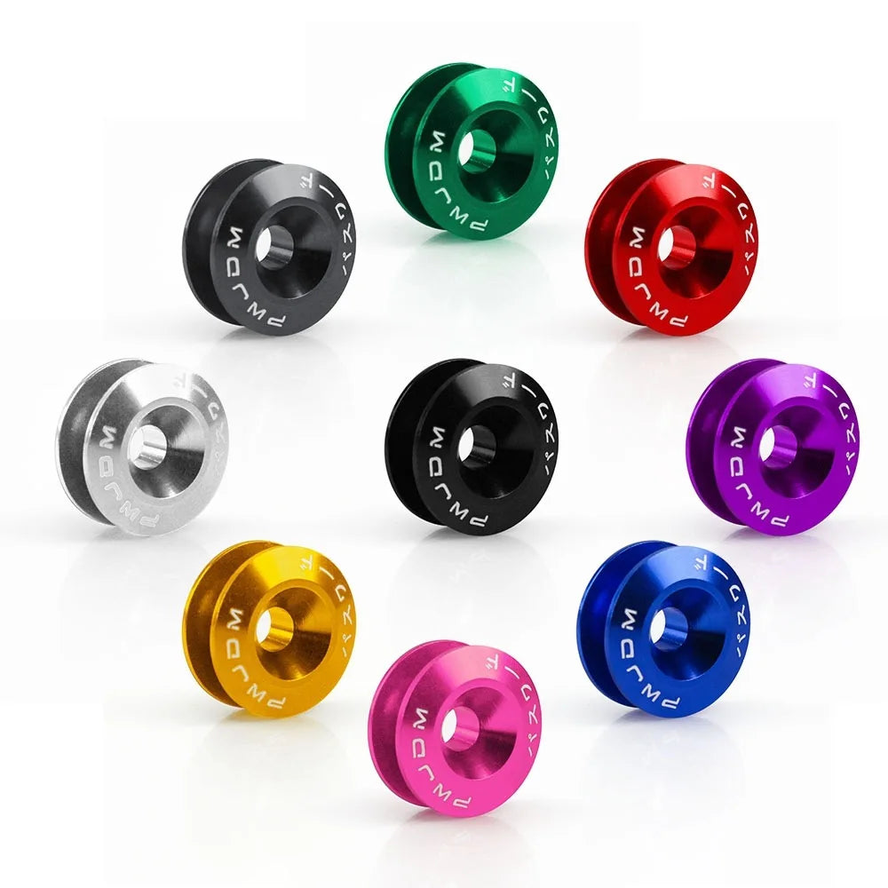 A collection of various colored aluminum quick release fasteners for automotive parts.