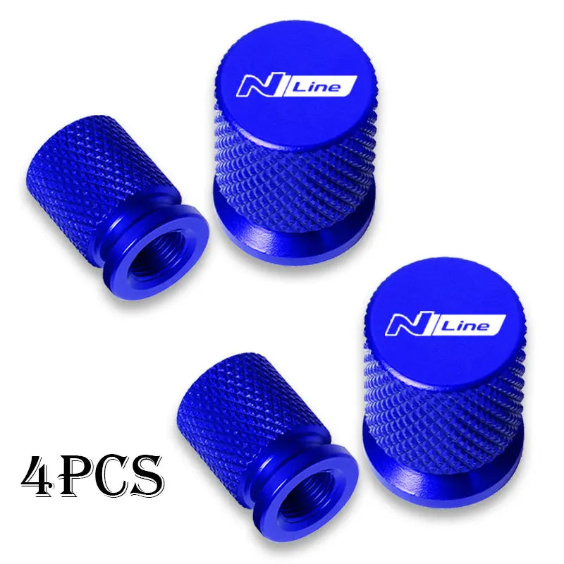 Set of four blue N Line CNC aluminum tire valve caps with textured grips
