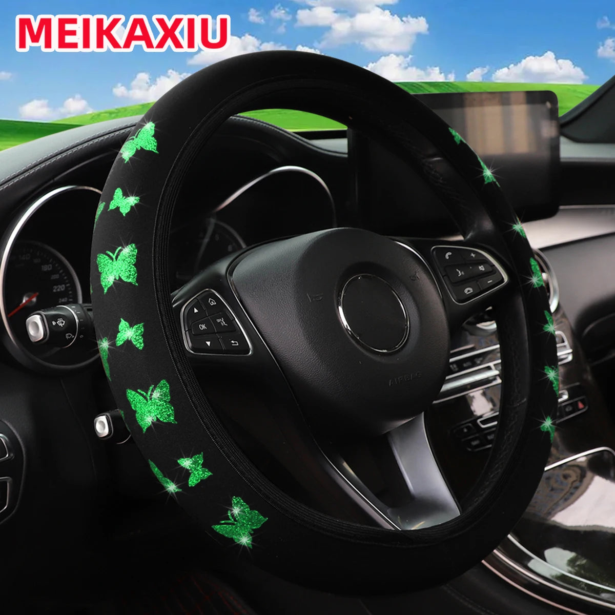 Cubierta del volante negra con mariposas de purpurina verde en el aro y los radios de cuero.