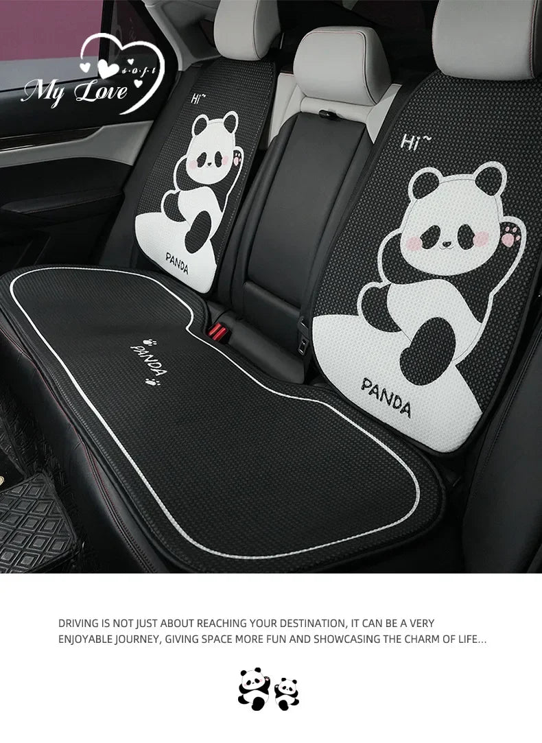 A set of black and white cartoon panda car seat cushions for a vehicle interior.
