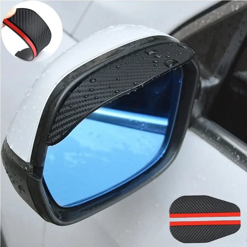 A close-up view of a black carbon fiber car rain visor designed to fit over a rearview mirror.