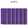Six pierres à pieds en verre violet disposées en ligne.
