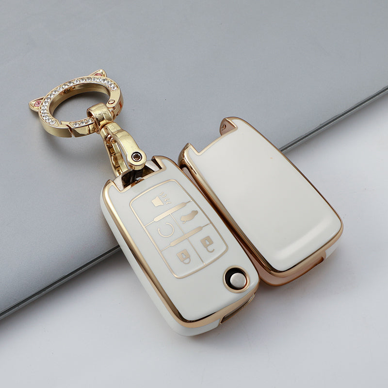 A gold-toned durable TPU key fob case for Chevrolet and GMC models, shown with its attached ring.