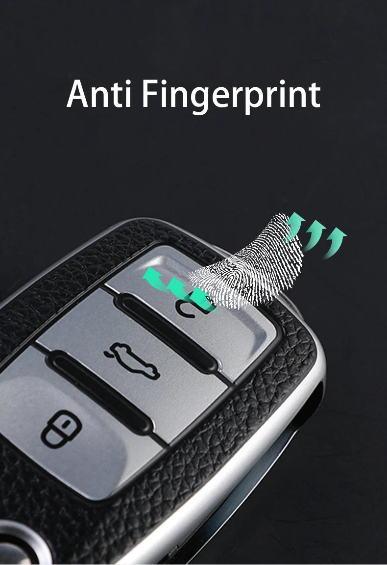 Close-up of a car key fob with an anti fingerprint cover being placed on it.