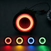 A round LED truck tail light with a red halo effect, showing various colors like red, yellow, blue, and green.