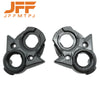 A pair of black and carbon fiber ignition switch covers for electric dirt bikes.