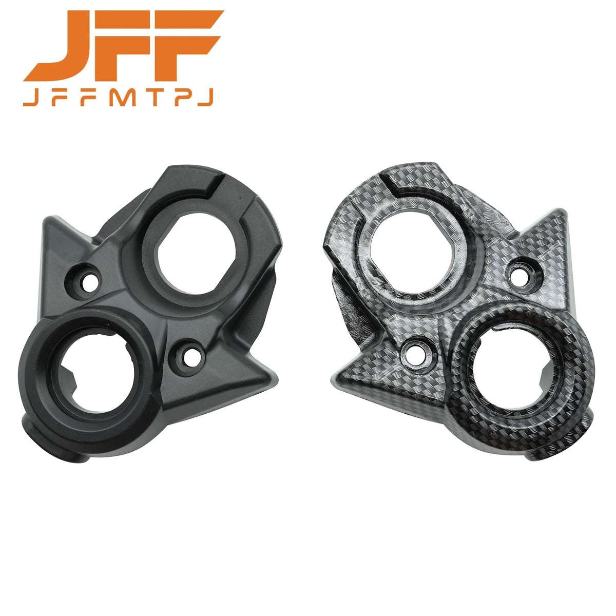 A pair of black and carbon fiber ignition switch covers for electric dirt bikes.