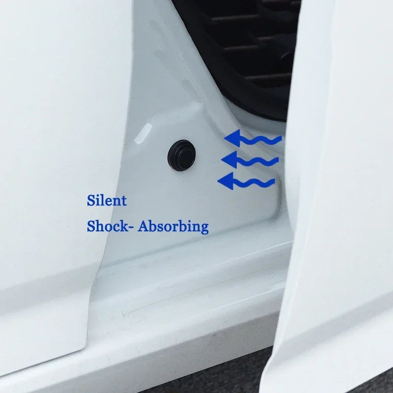 Close-up of a white car door showing a black silicone shock-absorbing pad for silent operation.