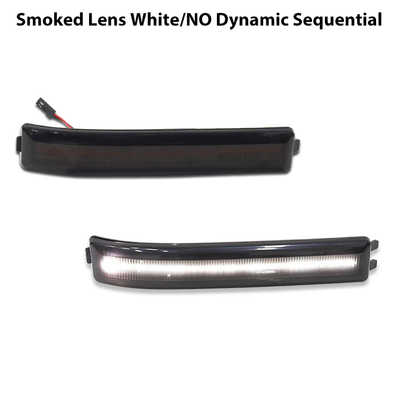 A black smoked lens light bar with an amber LED, used as a side mirror marker light.