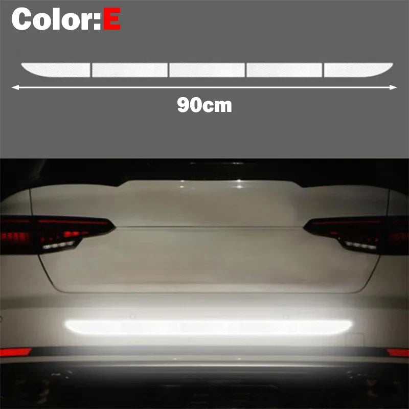A close-up view of a car's rear light assembly with a bright horizontal light strip.