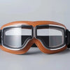 A pair of retro folding motorcycle windproof glasses with brown leather frames and clear lenses.