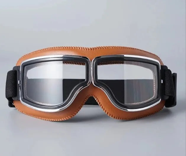 A pair of retro folding motorcycle windproof glasses with brown leather frames and clear lenses.
