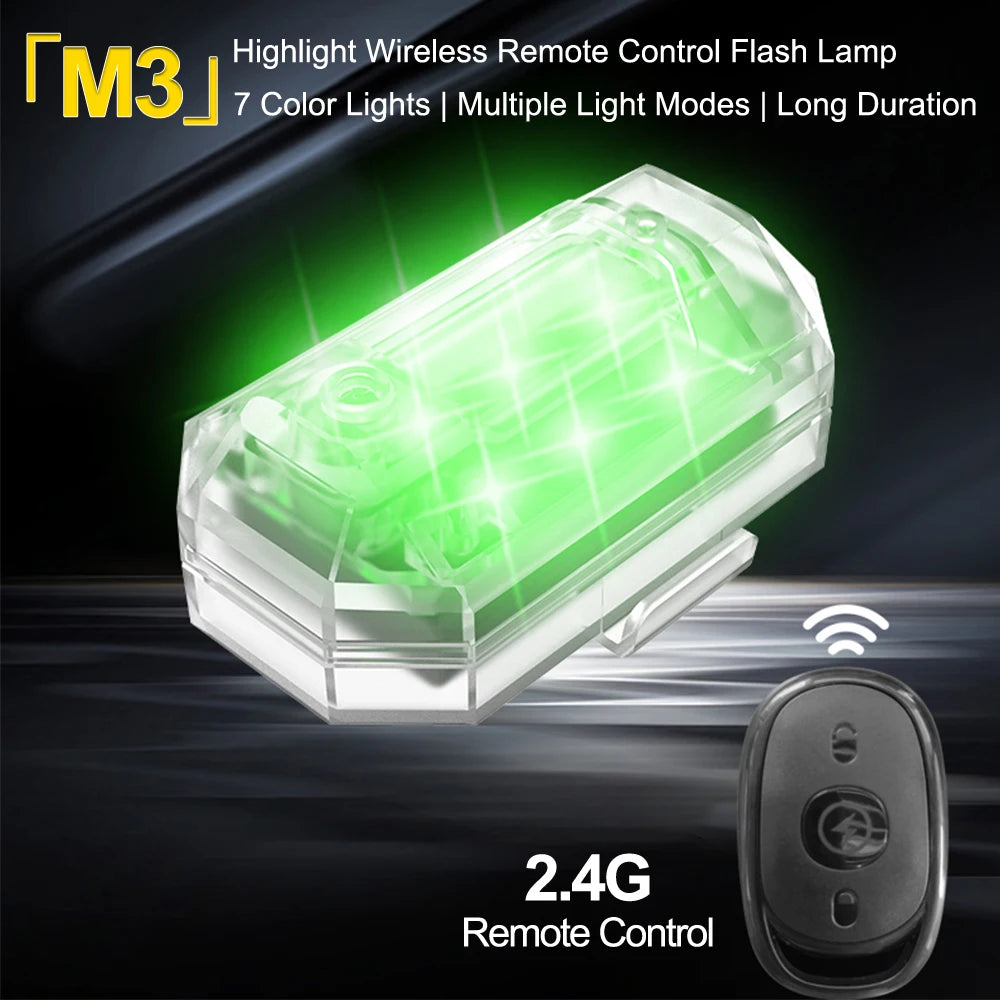 A clear wireless remote control flash lamp with a green light emitting from it, next to its controller.