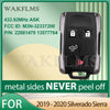 Black universal remote key for Chevy/GMC trucks with metal sides and FCC ID information
