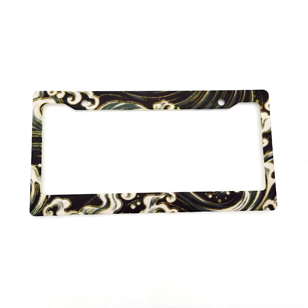 A rectangular license plate frame decoration with a marbled black and white pattern.