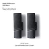 A pair of black Alcantara and Napa leather car roof handle covers for a Sport Series vehicle.