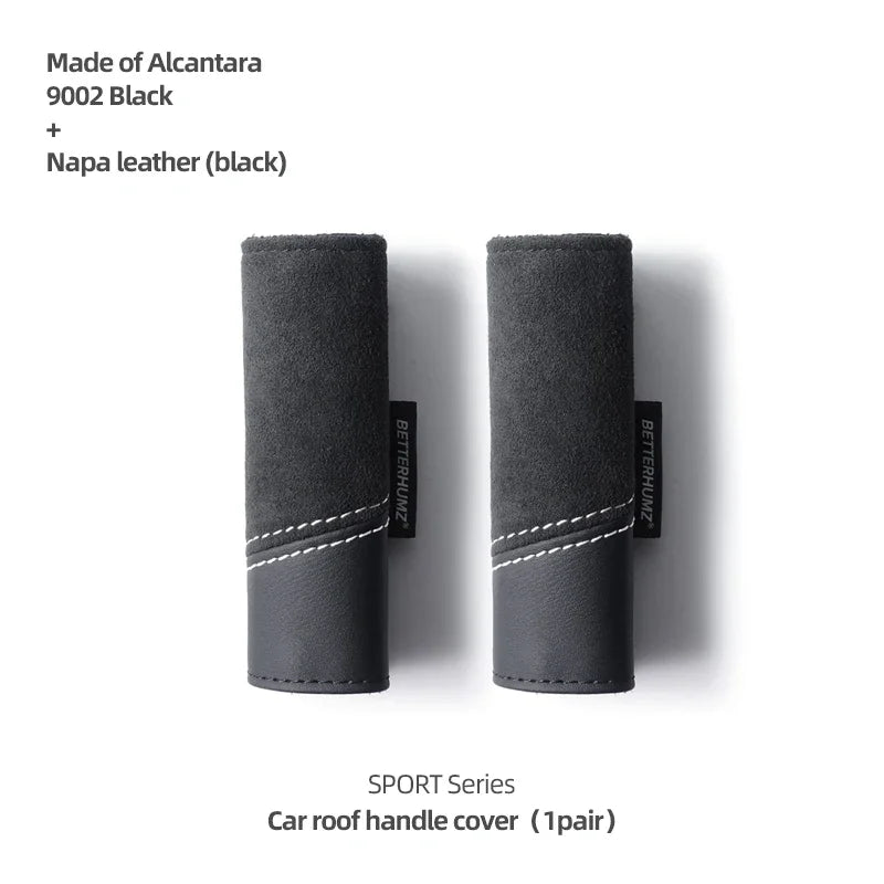 A pair of black Alcantara and Napa leather car roof handle covers for a Sport Series vehicle.