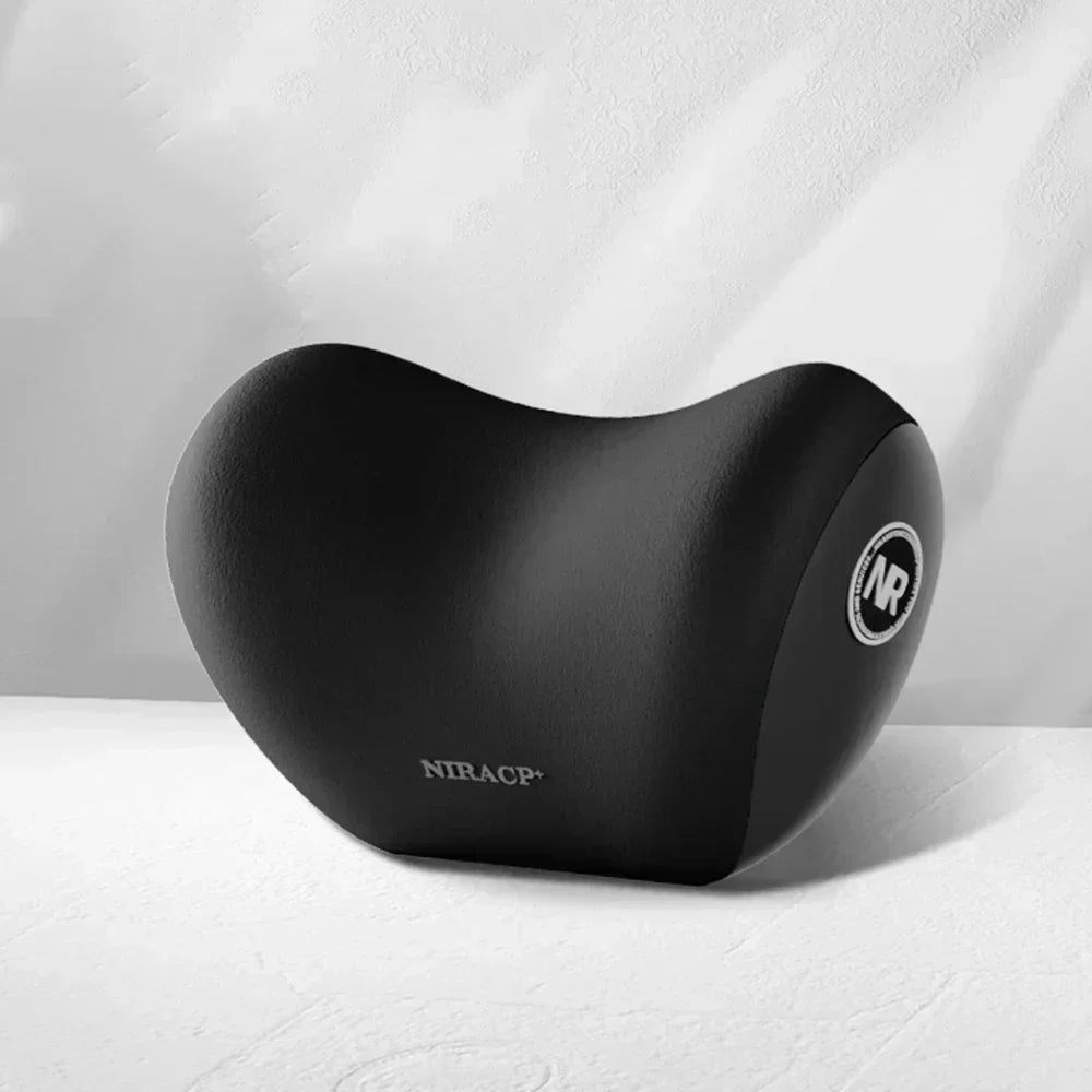 A black ergonomic memory foam neck and lumbar pillow set resting on a white surface.