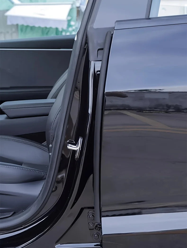 Close-up of a black car door edge rubber seal strip weatherstrip on the B-pillar.