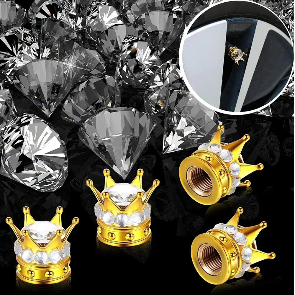 A set of gold and silver diamond rhinestone tire valve caps and a loose pile of clear diamonds.