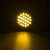 A close-up view of a round LED trailer tail light with multiple bright bulbs illuminating the dark background.