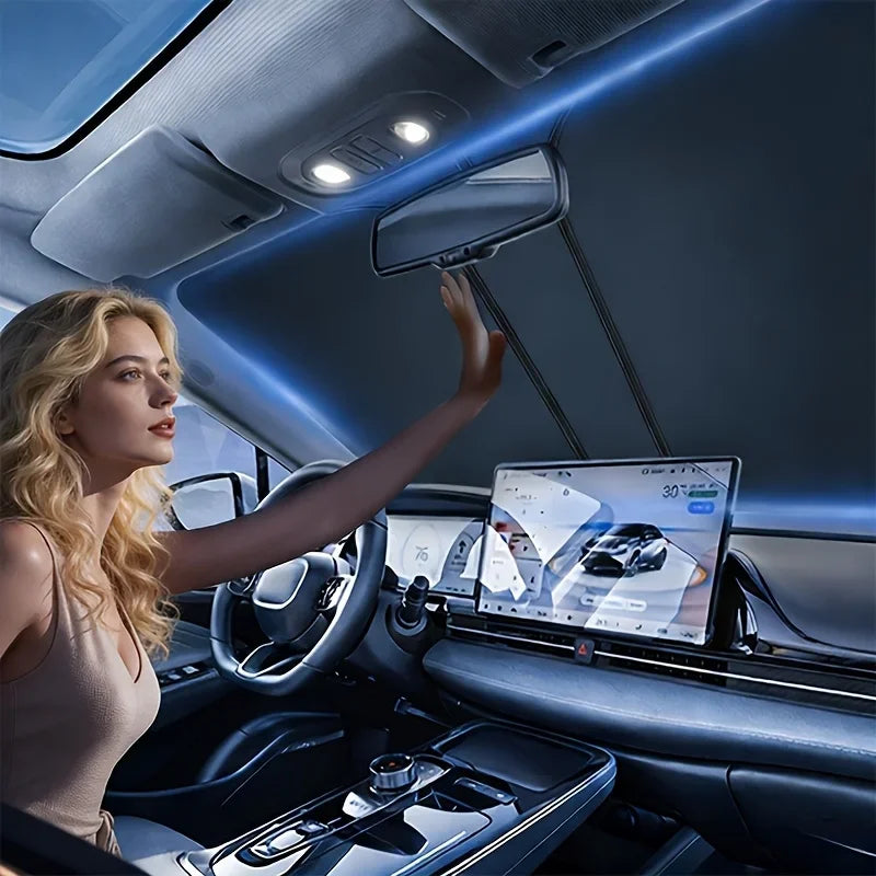 A woman in a car interior adjusts a rearview mirror and displays a digital interface on the dashboard.