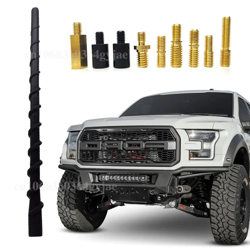 A universal vehicle AM/FM antenna mast and various mounting hardware components displayed next to a white truck.