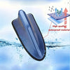 A blue shark fin universal car antenna amplifier is shown submerged in water, highlighting its waterproof material.
