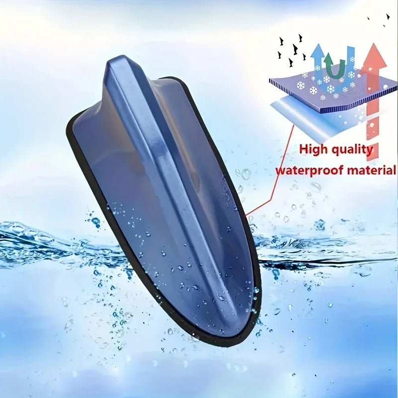 A blue shark fin universal car antenna amplifier is shown submerged in water, highlighting its waterproof material.