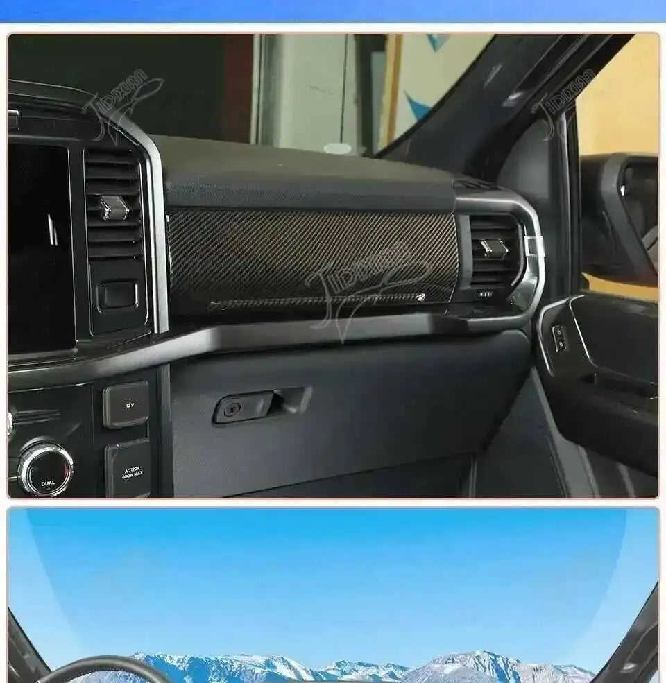 Close-up view of a black carbon fiber grain interior trim kit installed on the dashboard of a Ford F-150.