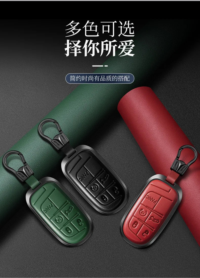 Three colored leather car key fobs are displayed against a dark background.