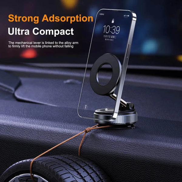 A clear magnetic car phone mount with a circular holder is shown resting on a dark car surface.