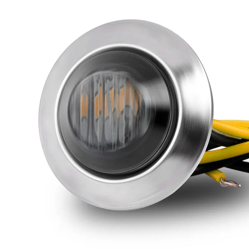 Silver round LED marker light housing with visible internal LED elements and yellow wiring.