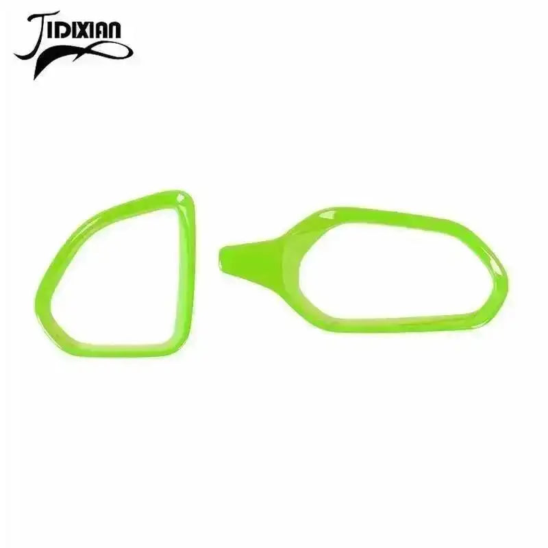A pair of bright lime green dashboard air vent covers for a Jeep Renegade, shown against a white background.