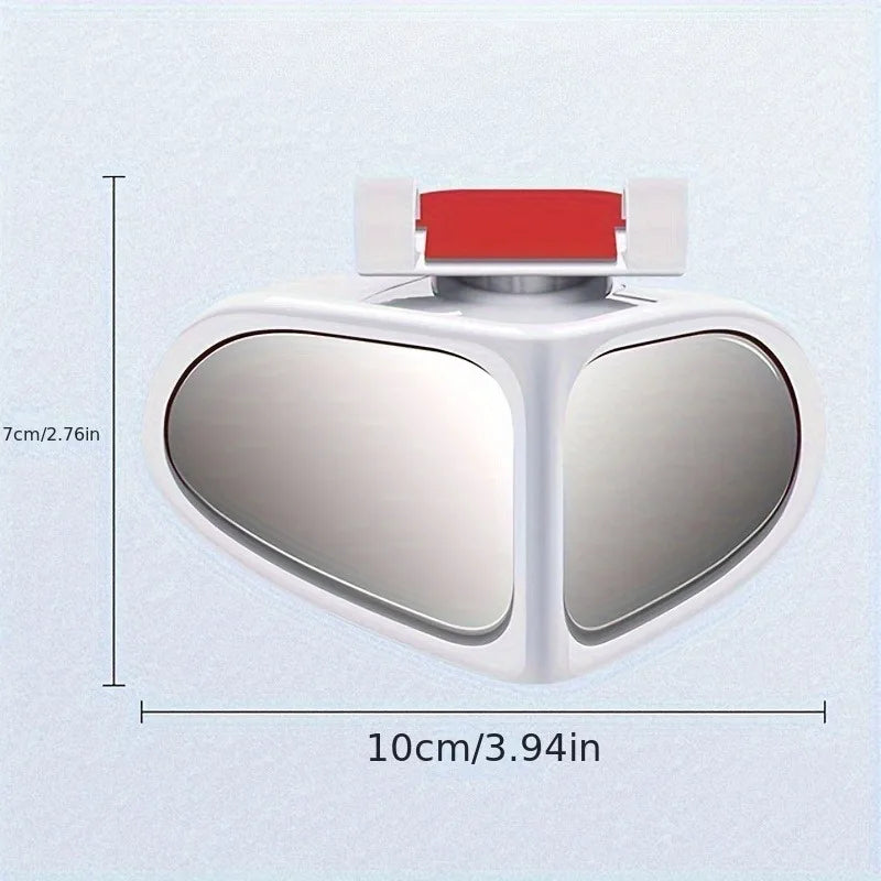 A white, heart-shaped blind spot mirror with a red adjustable strap, shown from above.