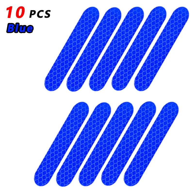 Ten blue reflective safety stickers or tape pieces arranged in a diagonal pattern.