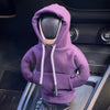 A purple Gear Shift hoodie cover is shown placed inside a car console.