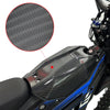Close-up of a black carbon fiber motorcycle mudguard and protection kit installed on a blue motorcycle.