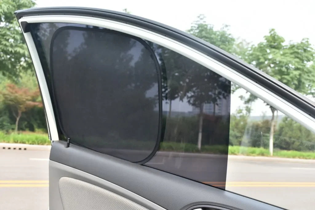A black universal car side window sun shade mesh is shown installed on a vehicle window.