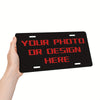 A hand holds a black license plate with red text that reads YOUR PHOTO OR DESIGN HERE