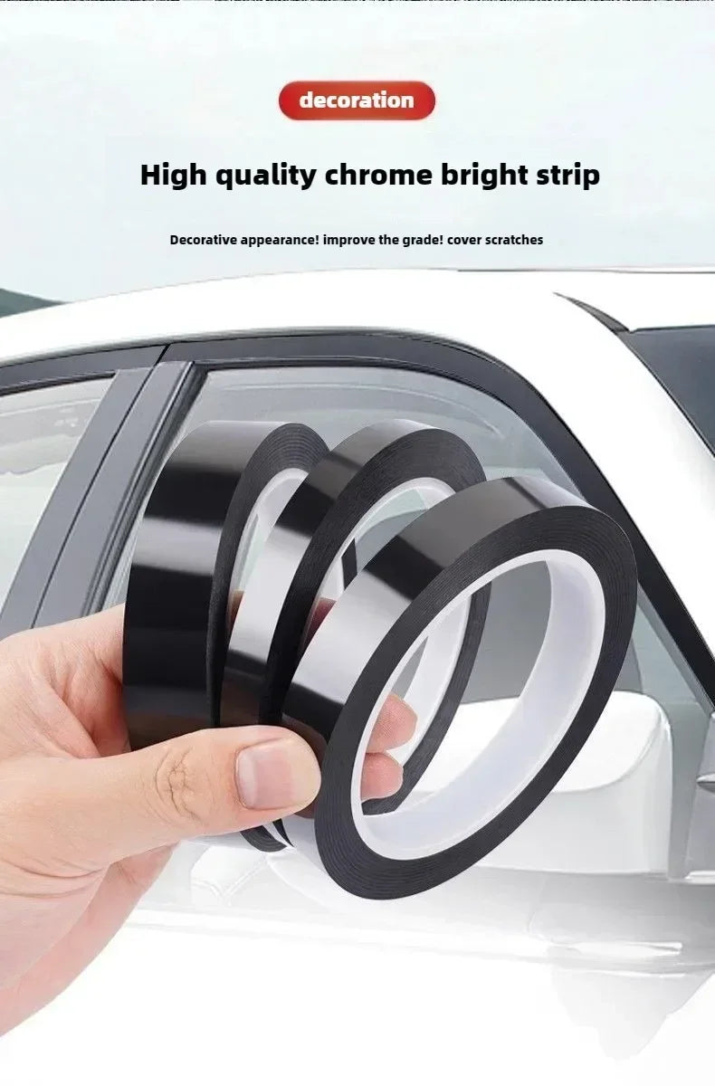 A hand holds several rolls of high quality chrome bright strip decorative window trim decals.