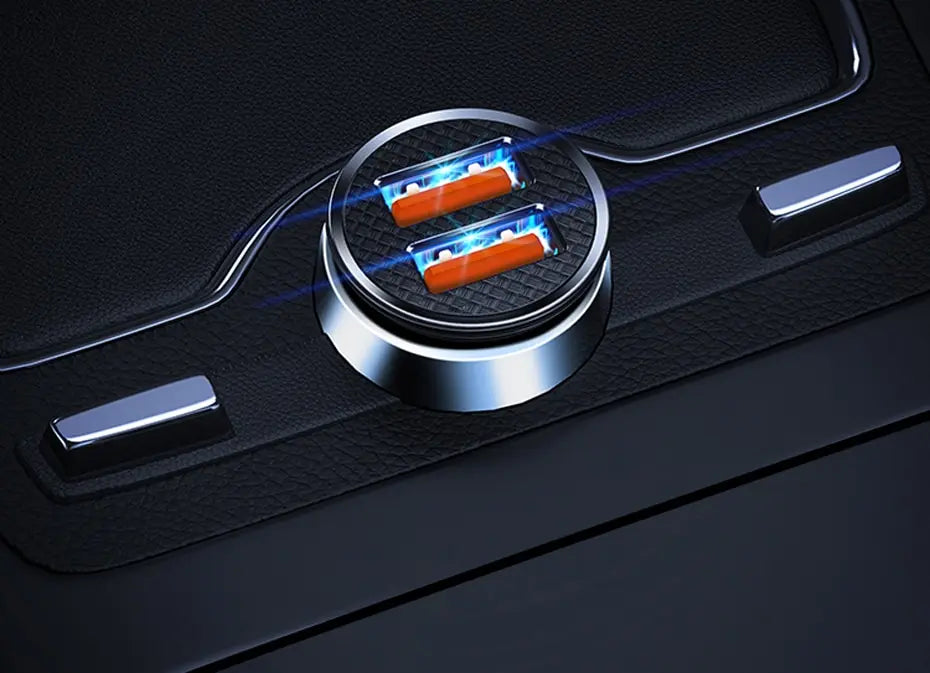 A close-up view of a 30W dual port car charger with blue light illuminating the charging ports on a black surface.