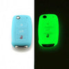 A silicone car key cover in light blue and neon green colors shown side by side.